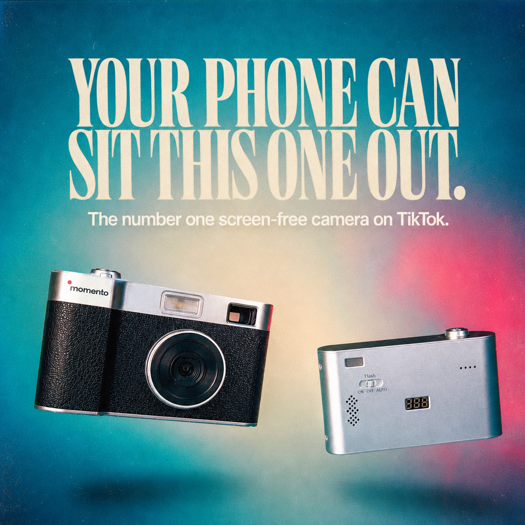 Front and back views of a MOMENTO silver and black screen-free camera